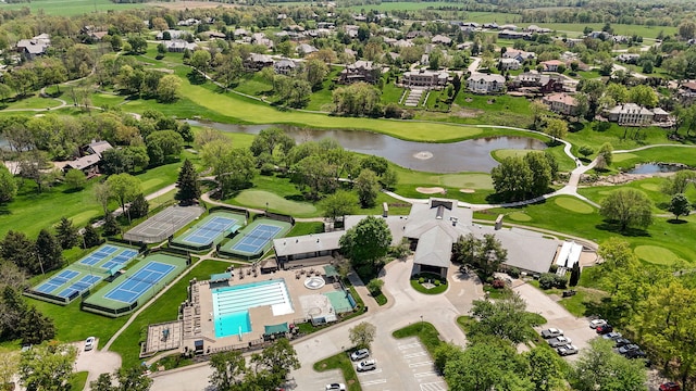 5245 S Stonehaven Dr, Springfield, MO 65809 - aerial view of property and surrounding area with a large body of water, a local golf course, a pool area, and nearby suburban area