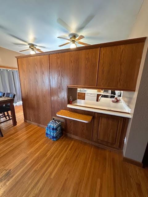home office featuring light wood finished floors and ceiling fan