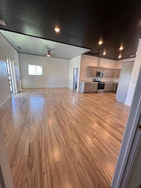 unfurnished living room featuring light wood-style floors