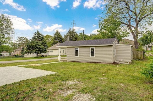 rear view of property with roof with shingles