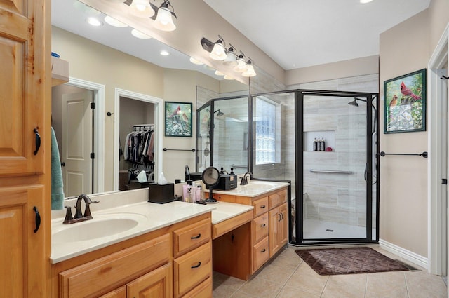 full bath with a shower stall, tile patterned flooring, double vanity, a walk in closet, and recessed lighting