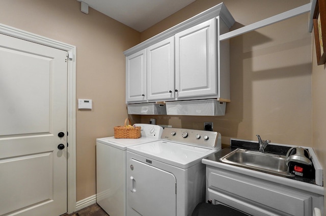 washroom featuring washing machine and clothes dryer and cabinet space