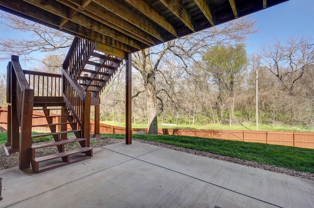 view of patio / terrace with stairs and fence