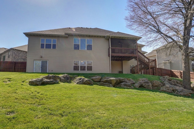 rear view of property featuring stairs and a sunroom