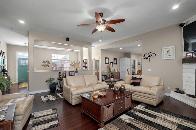 living area featuring ceiling fan, dark wood-type flooring, baseboards, and recessed lighting