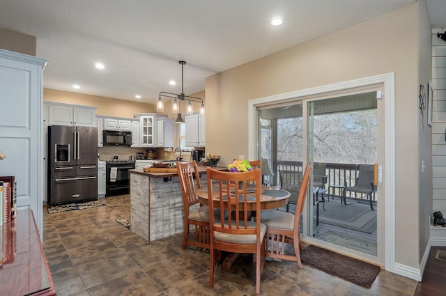 dining area with recessed lighting and baseboards