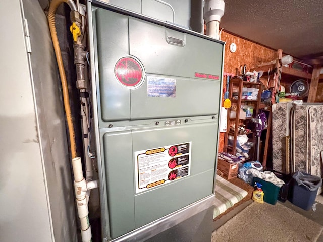 utility room featuring heating unit
