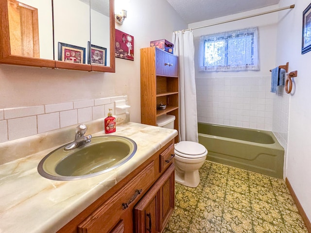 bathroom with toilet, vanity, shower / bathtub combination with curtain, and a textured ceiling