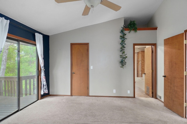 unfurnished bedroom with access to outside, light carpet, vaulted ceiling, baseboards, and ceiling fan