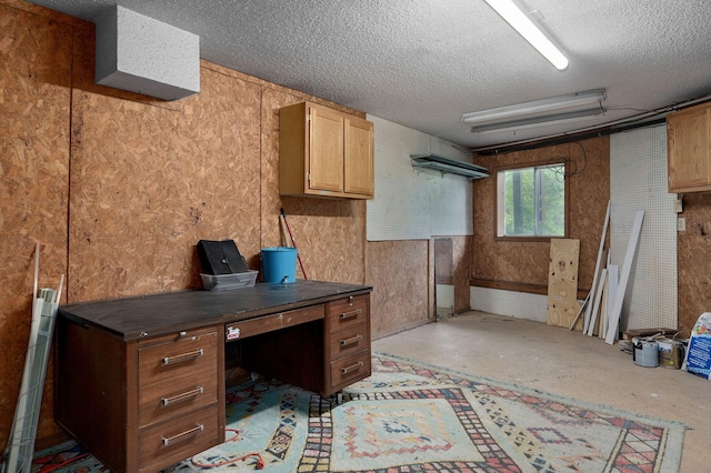 office area with a textured ceiling