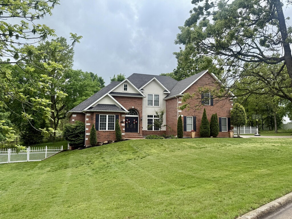 1911 Sherry Lea Dr, Neosho, MO 64850 - view of front facade featuring brick siding