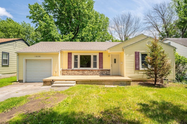 1606 N Waverly Ave, Springfield, MO 65803 - ranch-style house featuring a garage, driveway, a front yard, and brick siding