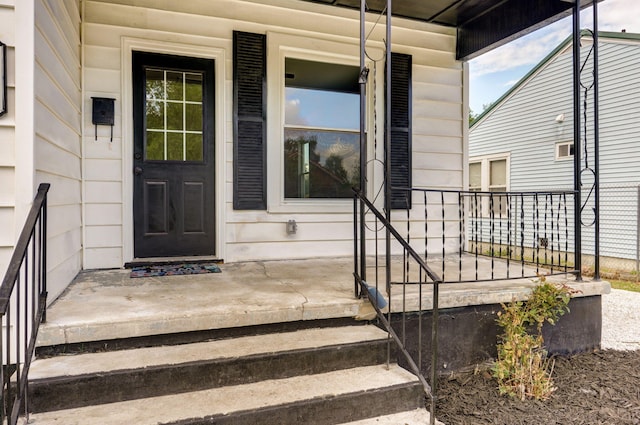 entrance to property featuring a porch