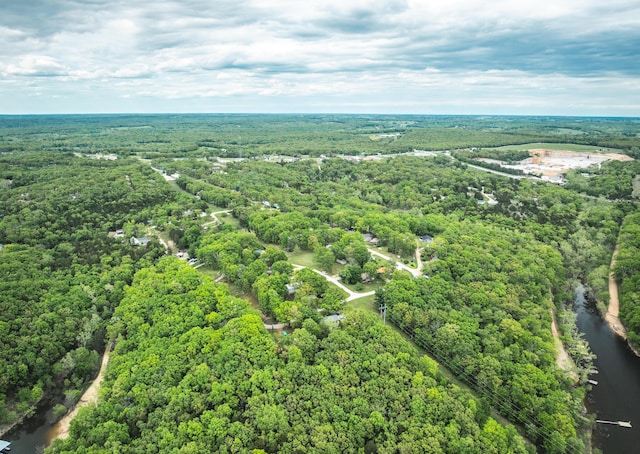 aerial view of a heavily wooded area and a large body of water