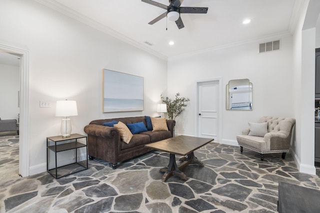 living room with stone floors, a ceiling fan, baseboards, recessed lighting, and ornamental molding