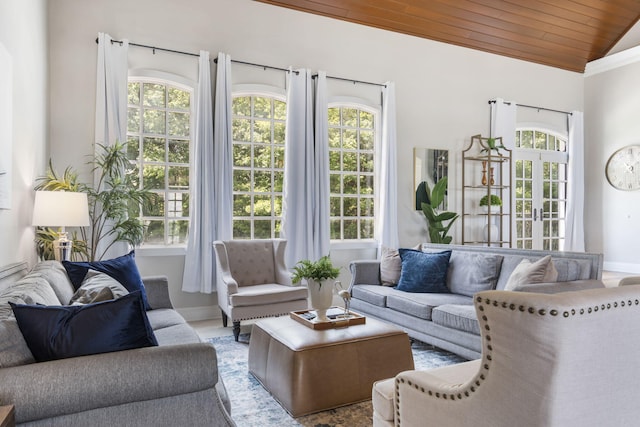 sunroom / solarium featuring french doors and vaulted ceiling