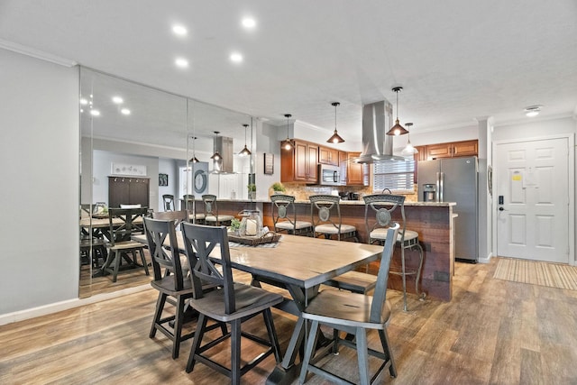 112 Overlook Dr Unit 5, Branson, MO 65616 - dining space featuring crown molding, light wood-style floors, recessed lighting, and baseboards
