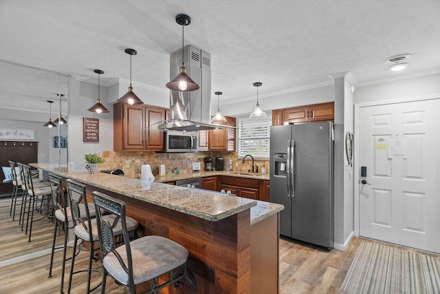 112 Overlook Dr Unit 5, Branson, MO 65616 - kitchen with stainless steel appliances, a sink, a peninsula, light wood-type flooring, and light stone counters