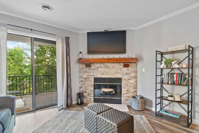 112 Overlook Dr Unit 5, Branson, MO 65616 - living area featuring crown molding, wood finished floors, a fireplace, and baseboards