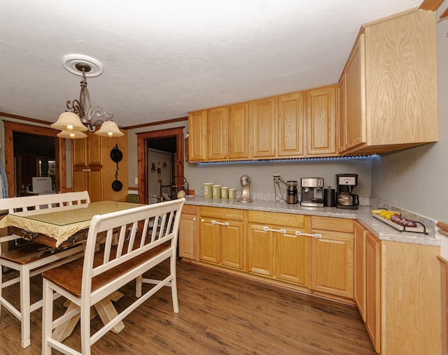 111 W Olive St, El Dorado Springs, MO 64744 - kitchen with wood finished floors, light countertops, a chandelier, and hanging light fixtures