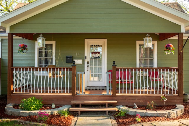 111 W Olive St, El Dorado Springs, MO 64744 - view of front of home featuring a porch