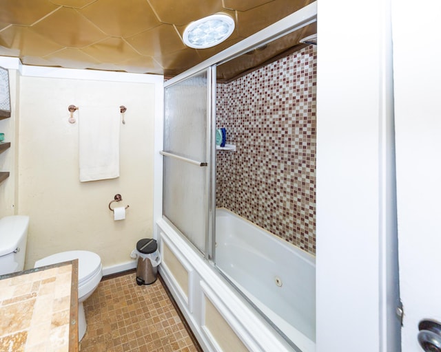 111 W Olive St, El Dorado Springs, MO 64744 - full bath featuring toilet, bath / shower combo with glass door, and baseboards