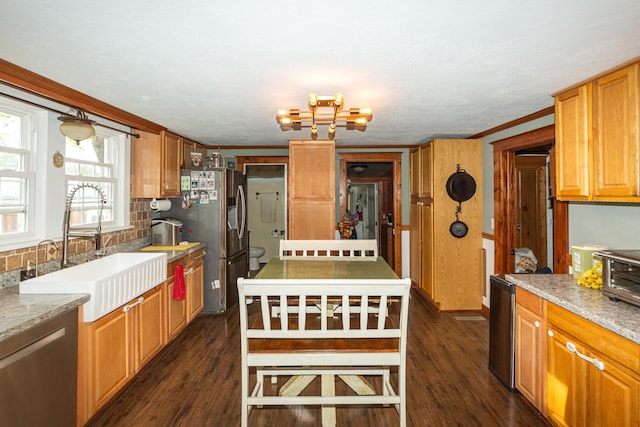 111 W Olive St, El Dorado Springs, MO 64744 - kitchen with a sink, stainless steel refrigerator with ice dispenser, dark wood-type flooring, tasteful backsplash, and light stone countertops