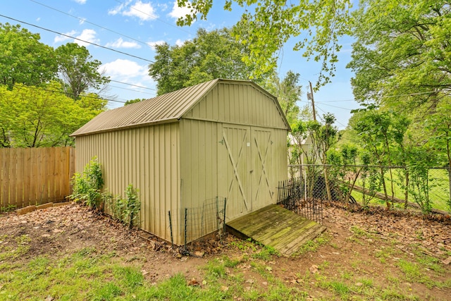 view of shed with a fenced backyard