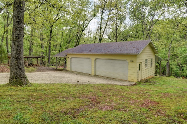 4855 E Cimarron Ln, Springfield, MO 65803 - detached garage featuring a wooded view