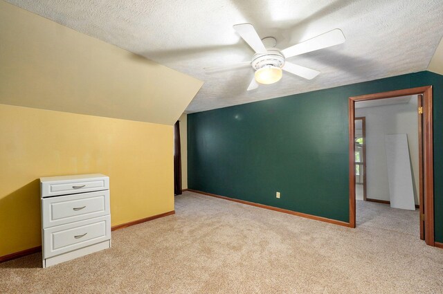 4855 E Cimarron Ln, Springfield, MO 65803 - bonus room with carpet floors, ceiling fan, lofted ceiling, baseboards, and a textured ceiling