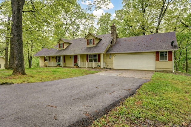 4855 E Cimarron Ln, Springfield, MO 65803 - cape cod home with covered porch, asphalt driveway, a garage, a chimney, and a front yard