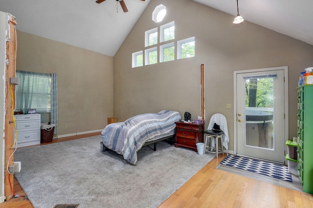 4855 E Cimarron Ln, Springfield, MO 65803 - bedroom featuring high vaulted ceiling, wood finished floors, multiple windows, access to outside, and ceiling fan