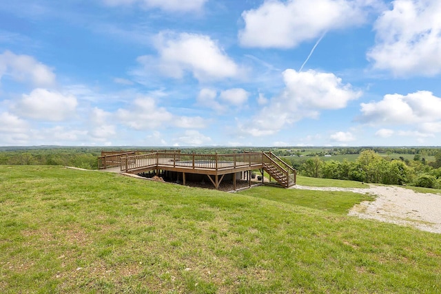 dock area featuring a yard, a wooden deck, a rural view, and stairs