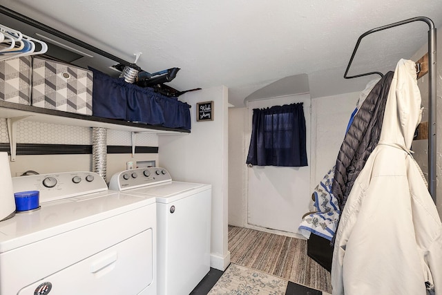 laundry area featuring washing machine and clothes dryer