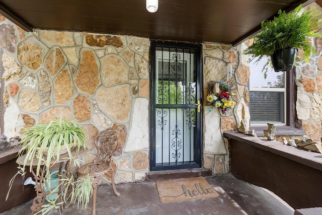 view of exterior entry with stone siding