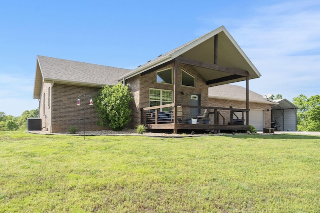 2885 Possum Trot Rd, Billings, MO 65610 - back of property featuring brick siding, a deck, a yard, and a shingled roof
