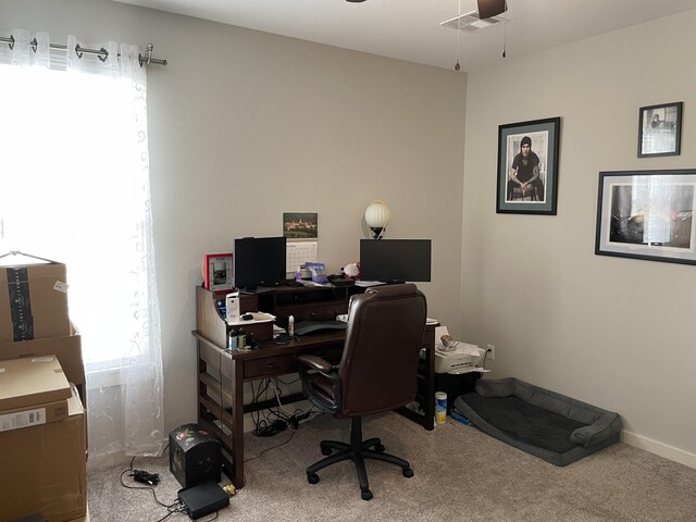 carpeted office with baseboards