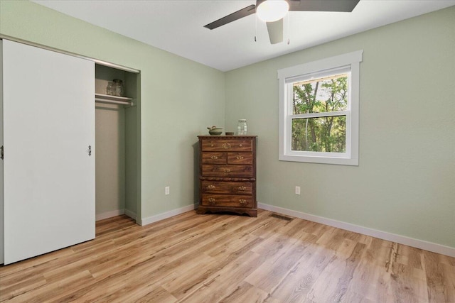 79 County Road 101, Gainesville, MO 65655 - bedroom with wood finished floors, a closet, ceiling fan, and baseboards