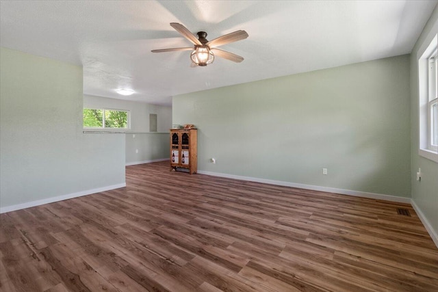 79 County Road 101, Gainesville, MO 65655 - empty room with ceiling fan, wood finished floors, and baseboards