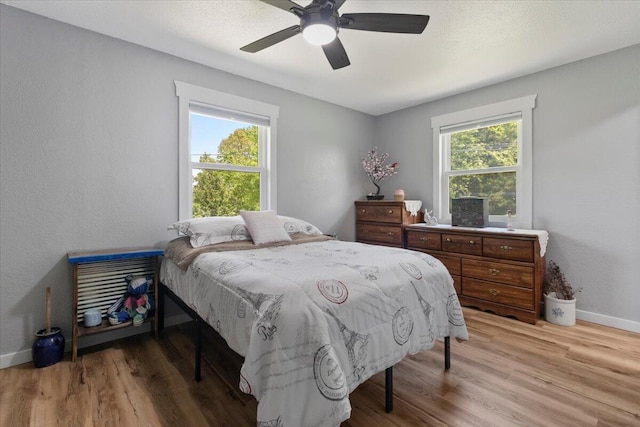 79 County Road 101, Gainesville, MO 65655 - bedroom featuring baseboards, light wood finished floors, and ceiling fan