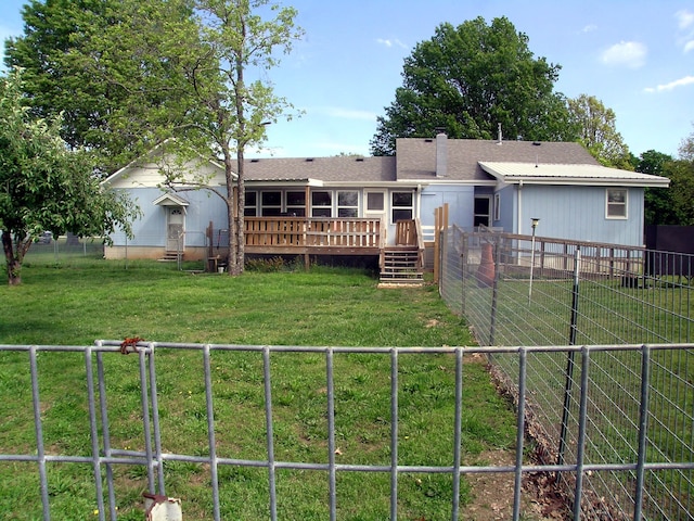 back of property with a deck and a chimney