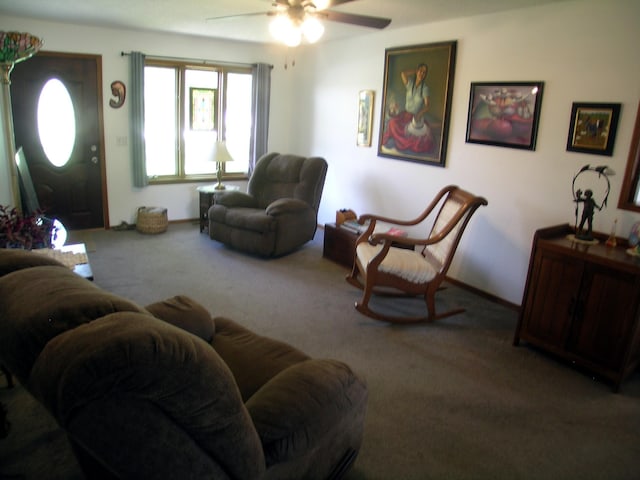carpeted living area featuring a ceiling fan