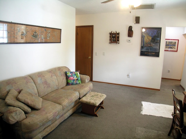 living room featuring carpet flooring, ceiling fan, and baseboards