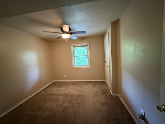 16709 Honeysuckle Hill Rd, Eminence, MO 65466 - spare room featuring ceiling fan, baseboards, dark colored carpet, and a textured ceiling