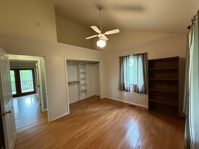 16709 Honeysuckle Hill Rd, Eminence, MO 65466 - unfurnished bedroom with light wood-type flooring, a closet, baseboards, high vaulted ceiling, and ceiling fan