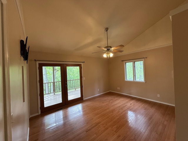 16709 Honeysuckle Hill Rd, Eminence, MO 65466 - spare room with french doors, wood finished floors, baseboards, a ceiling fan, and lofted ceiling
