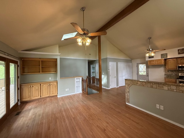 16709 Honeysuckle Hill Rd, Eminence, MO 65466 - unfurnished living room with ceiling fan, wood finished floors, high vaulted ceiling, beam ceiling, and baseboards