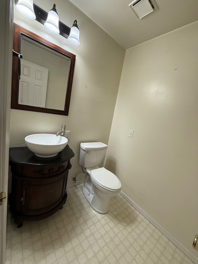 16709 Honeysuckle Hill Rd, Eminence, MO 65466 - bathroom featuring tile patterned floors, vanity, toilet, and baseboards
