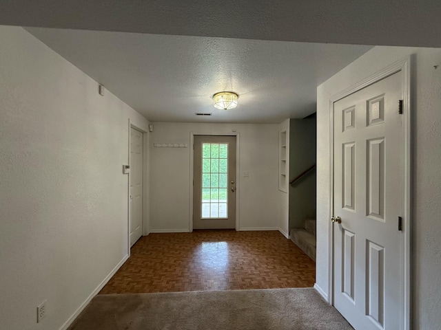 16709 Honeysuckle Hill Rd, Eminence, MO 65466 - entryway featuring baseboards and a textured ceiling