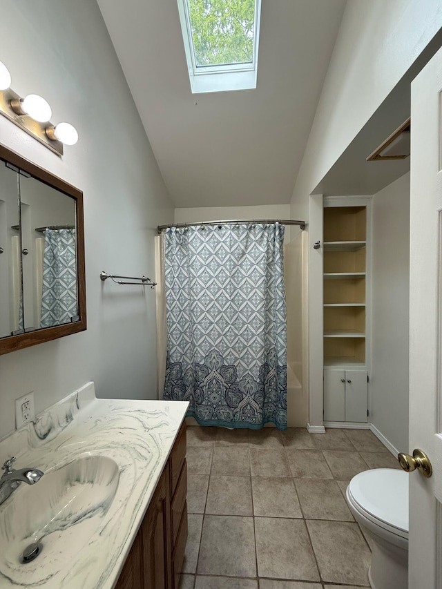 16709 Honeysuckle Hill Rd, Eminence, MO 65466 - bathroom featuring lofted ceiling, toilet, vanity, a skylight, and tile patterned floors